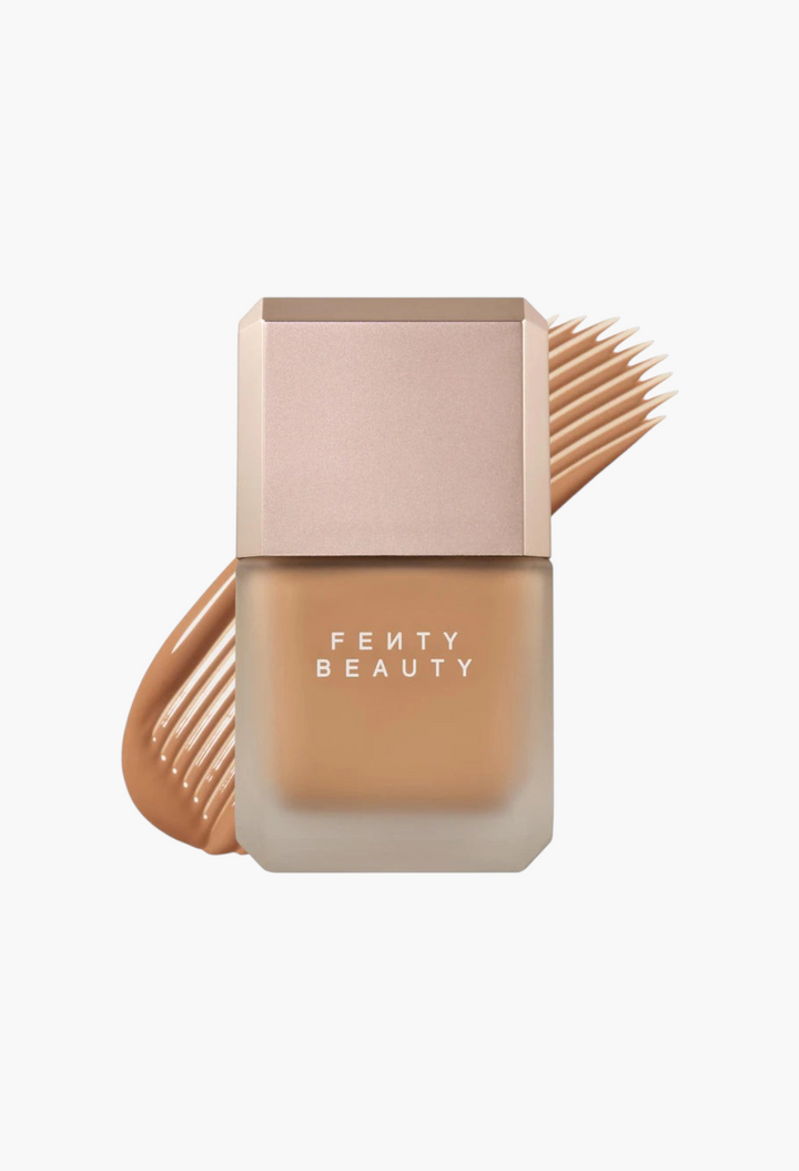 GLAM MODA Fenty Beauty Pro Filt'r liquid foundation bottle with a matte finish and a tan shade swatch behind it