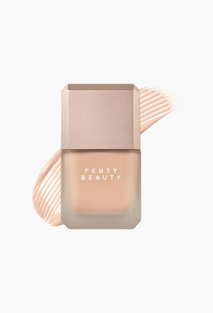 GLAM MODA Fenty Beauty Pro Filt'r liquid foundation bottle with a matte finish and a beige foundation swatch behind.