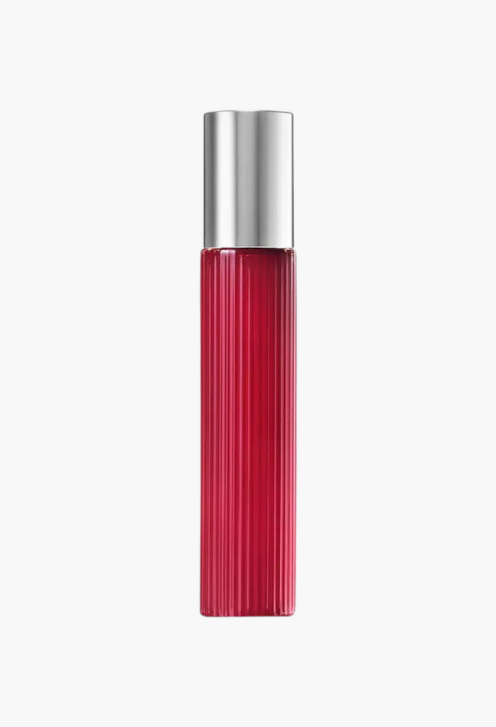 GLAM MODA Lost Cherry Eau de Parfum in a tall, ribbed, deep cherry-red glass bottle with a silver cap.