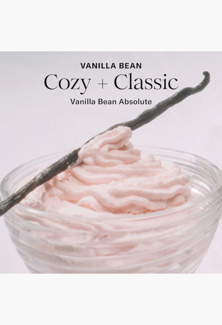 GLAM MODA whipped argan oil body butter in a glass jar topped with a vanilla bean, featuring a soft pink cream texture.
