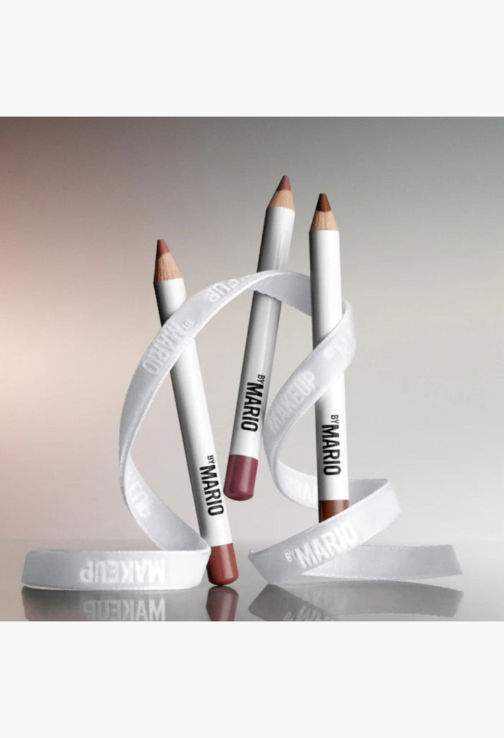 GLAM MODA trio of mini Ultra Suede sculpting lip pencils in neutral shades wrapped in a white branded ribbon.