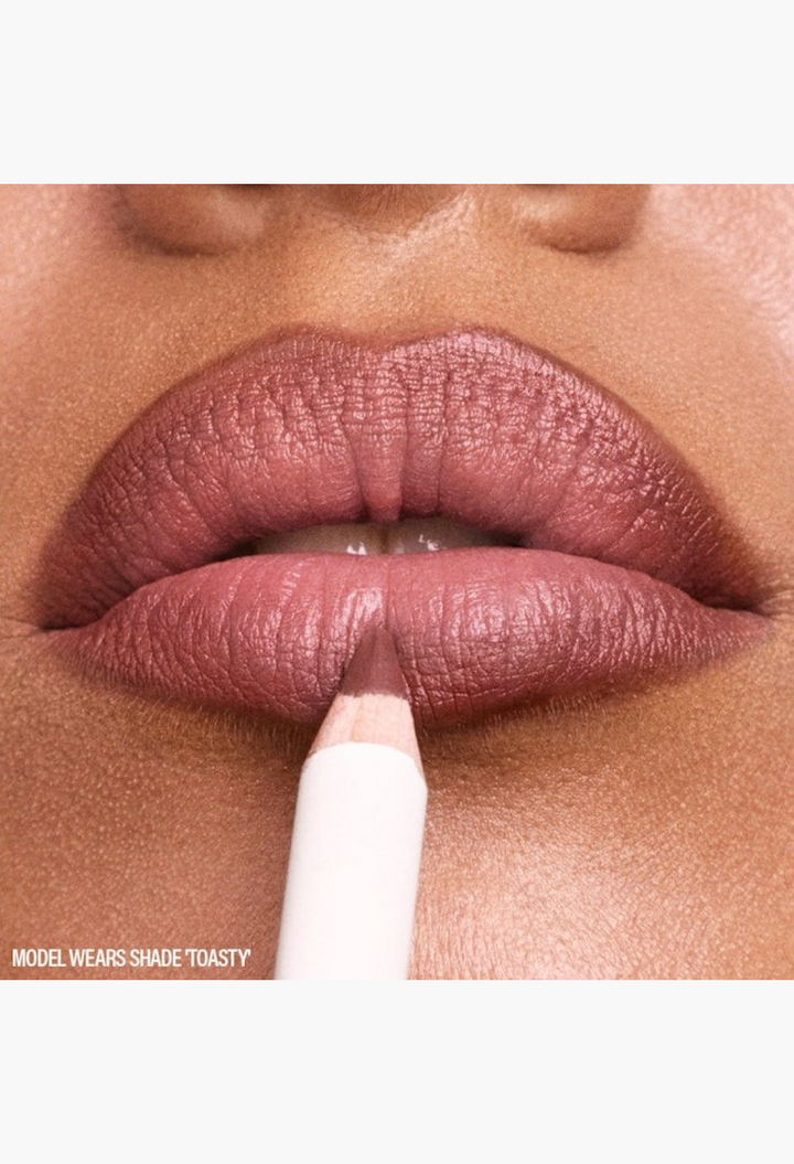 GLAM MODA lip pencil in shade Toasty being applied to define and sculpt a model's lips for a matte finish