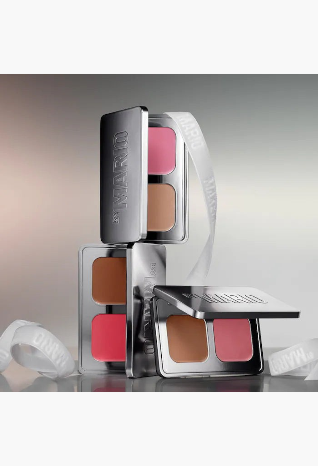 GLAM MODA mini compacts featuring dewy cream blush and bronzer balms in sleek silver packaging with branded ribbons.