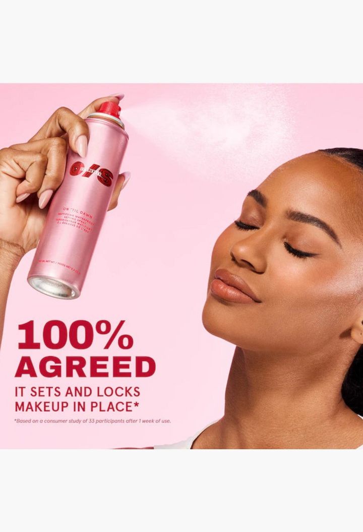 GLAM MODA On 'Til Dawn mattifying waterproof setting spray being applied by a woman for a long-lasting finish