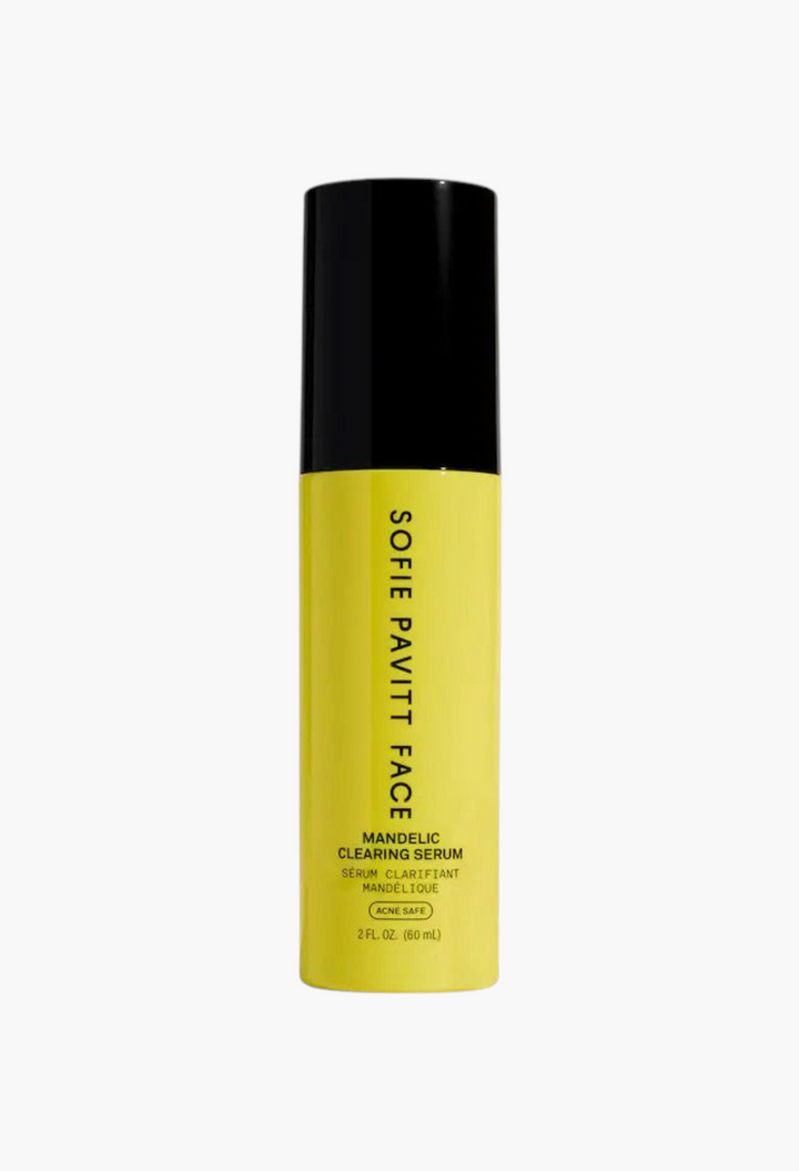 GLAM MODA Sofie Pavitt Face Mandelic Acid exfoliating and clearing serum in a bright yellow bottle with black cap.
