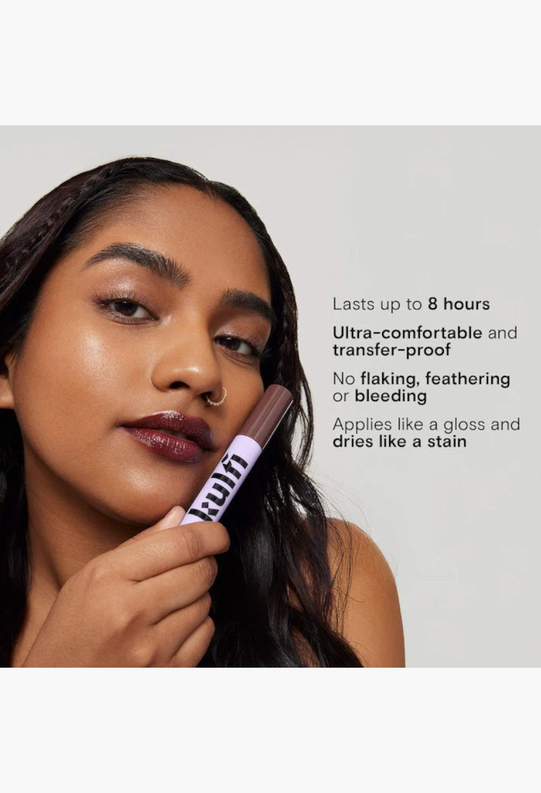 GLAM MODA model applying a deep rosy nude staining lip oil from the Lassi Lips duo, featuring a glossy finish.
