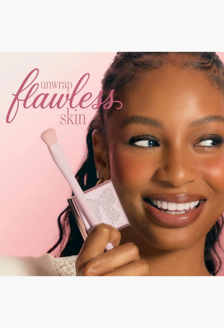 GLAM MODA face card never declines CC undereye corrector and brush set with diamond-studded packaging held by a model
