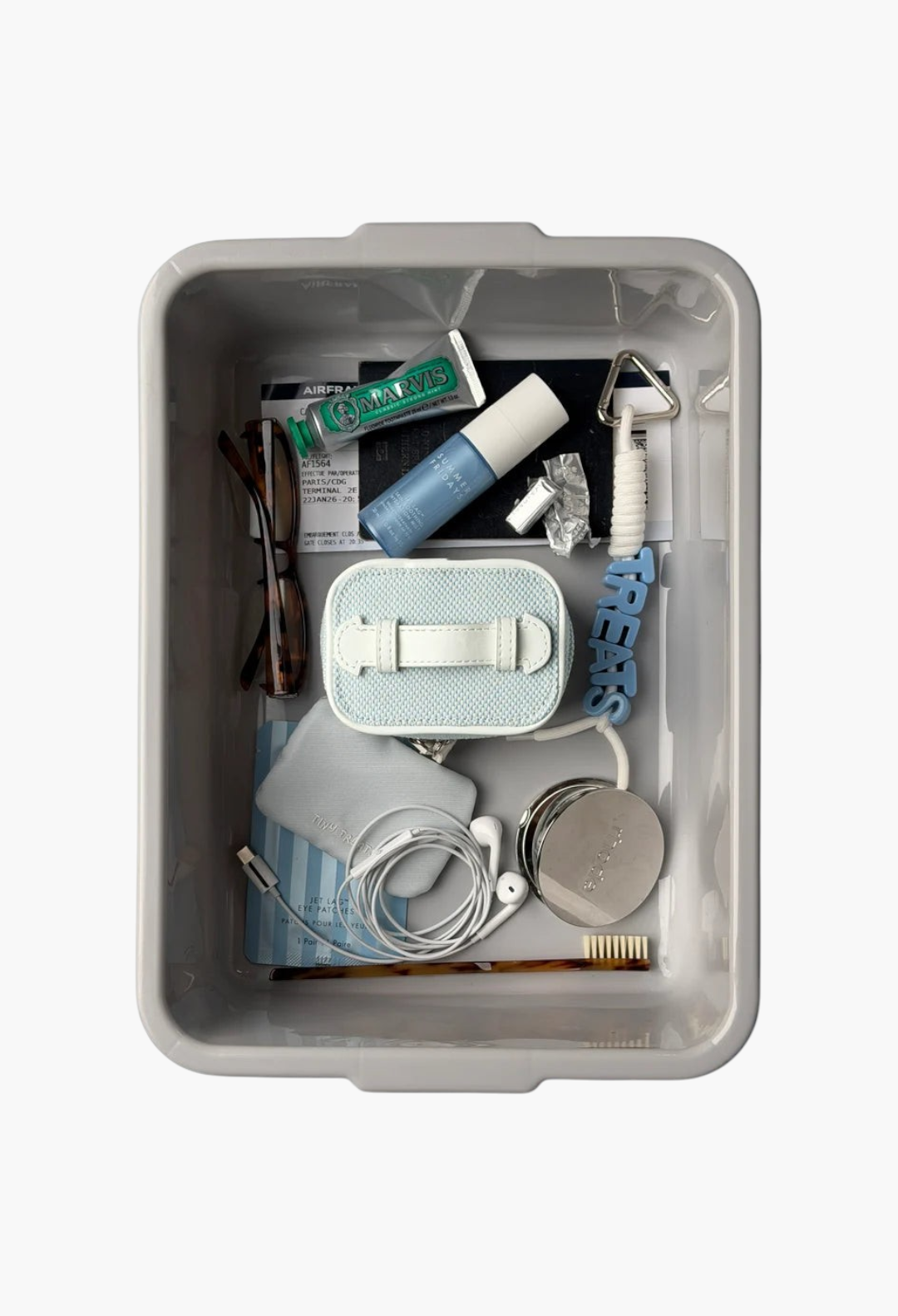 GLAM MODA mini jewellery case in blue and white checkerboard canvas, packed inside a travel bin with toiletries.