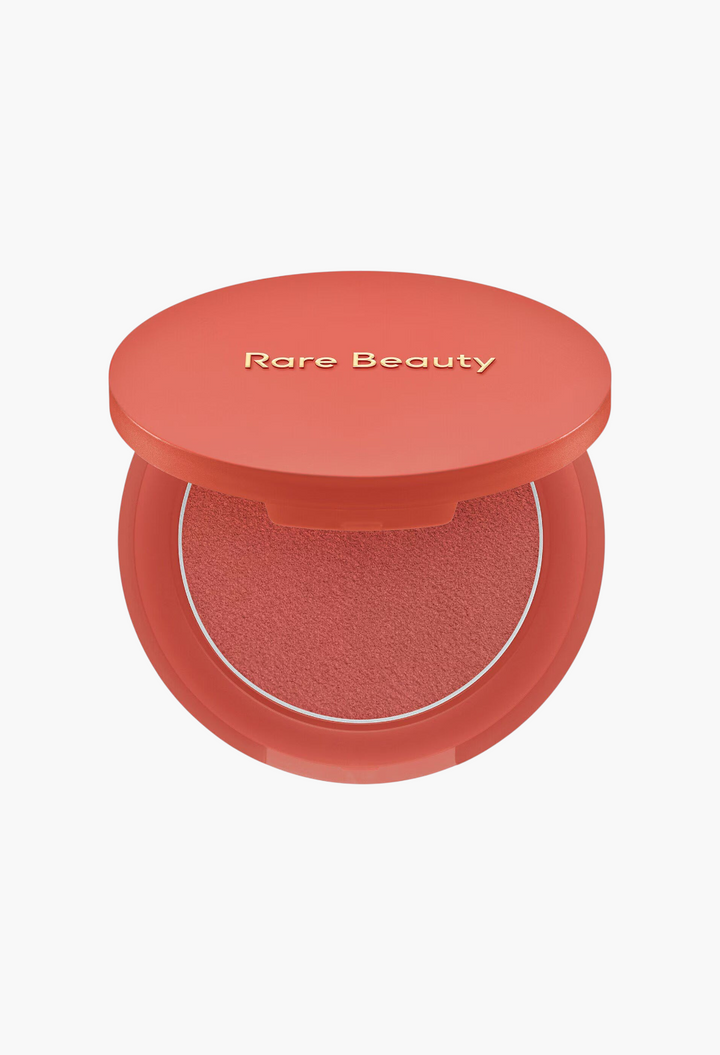 GLAM MODA Soft Pinch Matte Bouncy Blush in a coral shade with a smooth, buildable putty texture in a round compact.