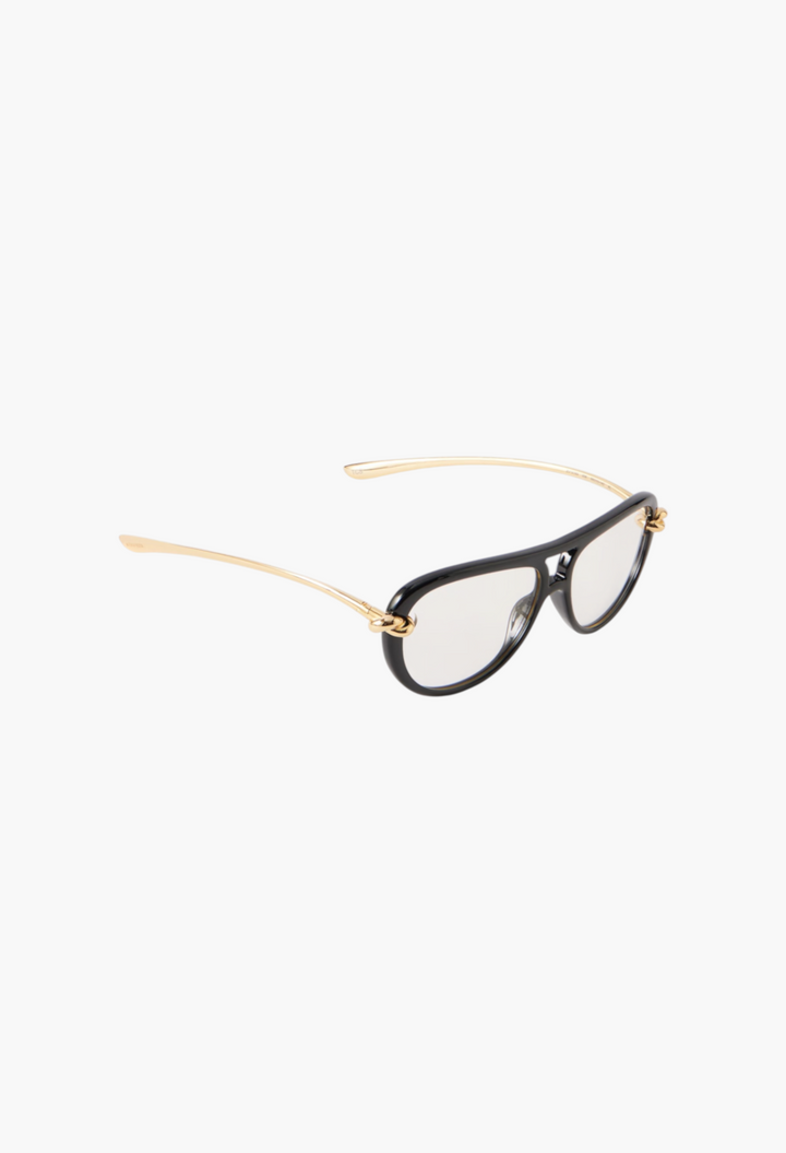 GLAM MODA New Knot aviator sunglasses with black frames, transparent lenses, and gold-tone twisted metal temples.