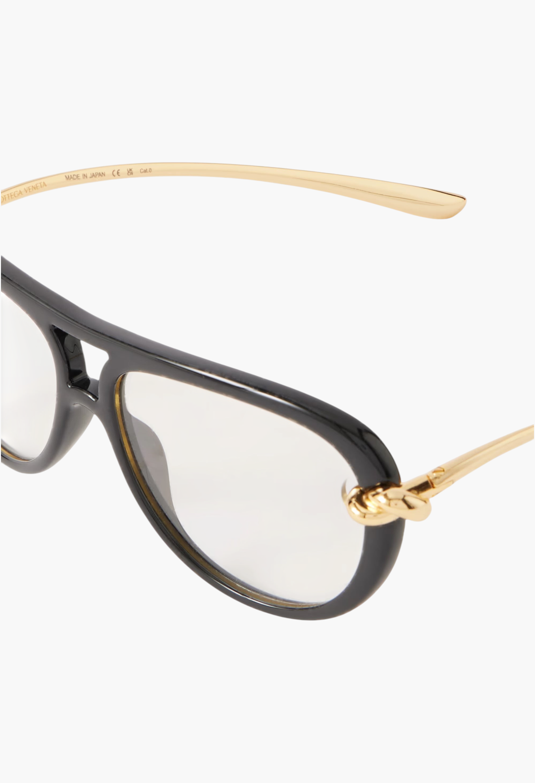 GLAM MODA Bottega Veneta New Knot aviator sunglasses with black frames, transparent lenses, and gold-tone twisted temples