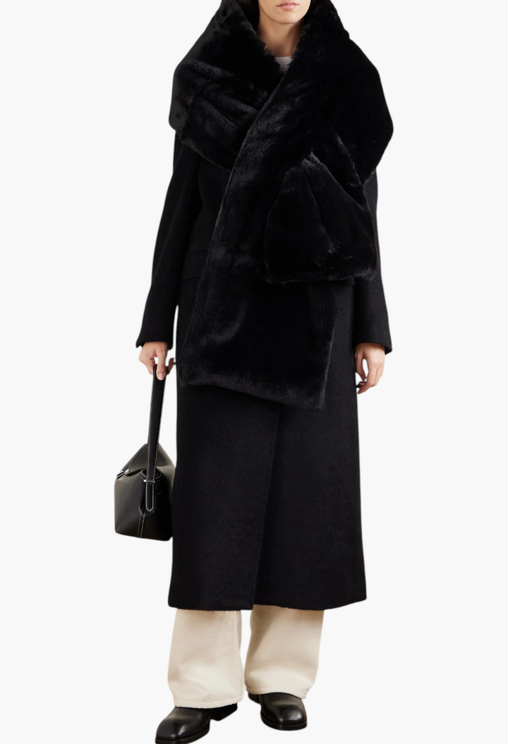 GLAM MODA Piacere black plush scarf with quilted shell trim worn by a model in a long coat and white trousers
